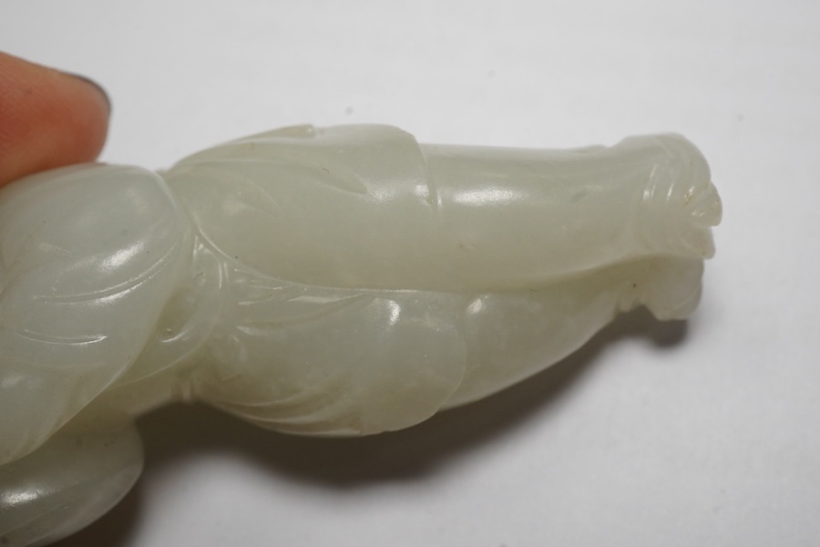 A Chinese white jade figure of a monkey trainer, 18th century